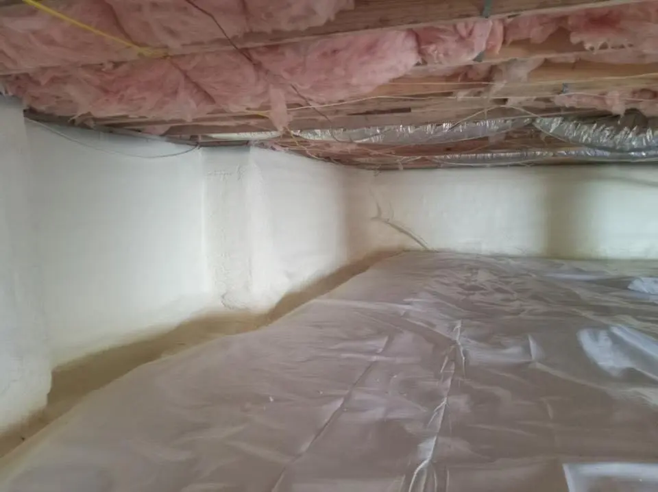 Crawl space encapsulation with closed-cell spray foam for Commercial Roof Restoration in Humble